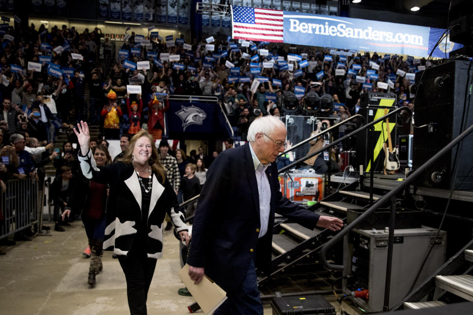 Democratic presidential candidate Sen. Bernie Sanders, I-Vt., and his wife Jane Sanders, left, take the stage for a campaign stop at the Whittemore Center Arena at the University of New Hampshire, Monday, Feb. 10, 2020, in Durham, N.H. (AP Photo/Andrew Harnik)