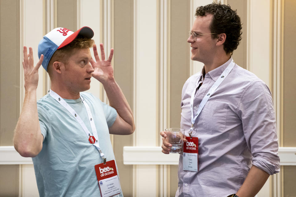 Backup Associate Pronouncer, Christian Axelgard, left, and Frank Cahill talk during a meeting of the word panel to finalize the 2023 Scripps National Spelling Bee words on Sunday, May 28, 2023, at National Harbor in Oxon Hill, Md. (AP Photo/Nathan Howard)