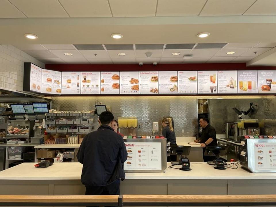 A customer orders food at Chick-fil-A on Tuesday, Feb. 20, 2024, at 2101 Alta Arden Expressway.