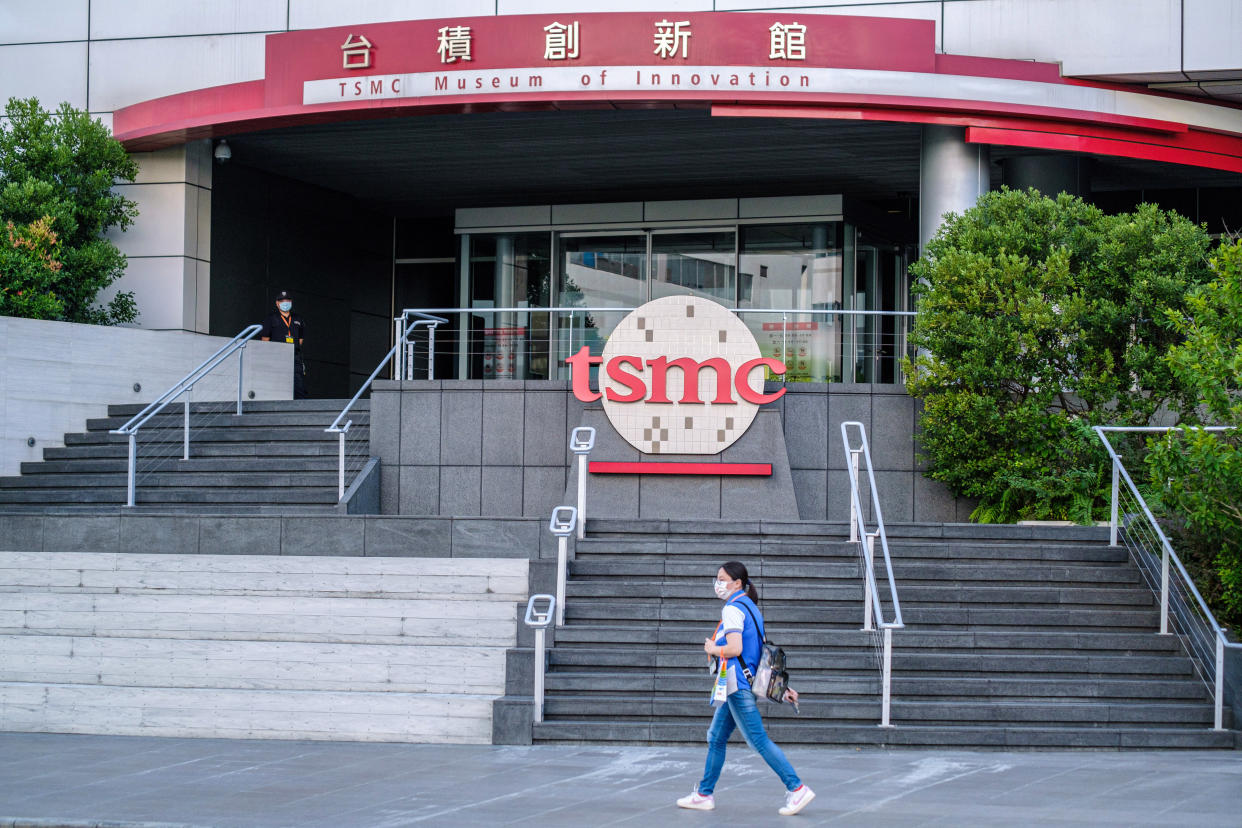 HSINCHU, TAIWAN - 2021/09/22: A person walks past a TSMC (Taiwan Semiconductor Manufacturing Company) logo at the Taiwanese semiconductor contract manufacturing and design company building in Hsinchu. (Photo by Walid Berrazeg/SOPA Images/LightRocket via Getty Images)