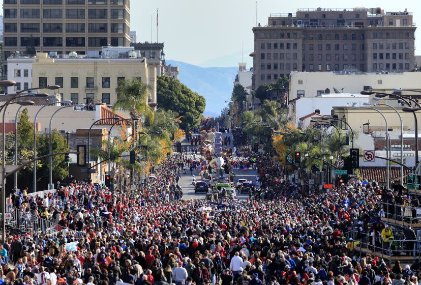 PASADENA CA., JANUARY 1, 2020: The Crowds of spectators follow the final floats and bands down Colorado Blvd at the end of the 131st Rose Parade (Mark Boster For the LA Times).