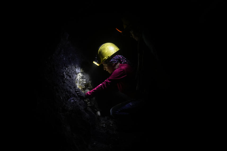 Emerald miner Deisy Alexa Gallo works inside an informal mine near the town of Coscuez, Colombia, Wednesday, Feb. 28, 2024. Colombian emeralds are known around the world for their quality and the best can be sold for thousands of dollars, though most people in the industry aren’t wealthy. (AP Photo/Fernando Vergara)