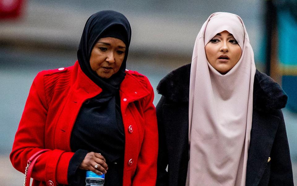 Amaani Noor, 21, (right) arrives at Liverpool Crown Court where she is appearing on charges of funding an Islamic State group - PA