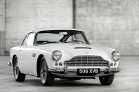 <p>The DB4 coupe made its first official appearance at the London Motor Show in 1958. Its beautiful body – consisting of aluminium panels supported by a tubular frame – was designed by Carrozzeria Touring of Milan, and enclosed a new and impressively powerful 240bhp 3.7-litre straight-six engine.</p><p>For its time, the DB4 was very fast, and was said to be able to accelerate from 0-100mph and brake to a standstill in under 30 seconds. A convertible derivative appeared three years later, but by that time two other major developments had taken place.</p>