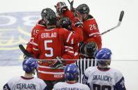 Canada's Derrick Pouliot (L) Aaron Ekblad (5), Nic Petan (19), Sam Reinhart and Curtis Lazar (26) celebrate Petan's empty net goal against Slovakia during the third period of their IIHF World Junior Championship ice hockey game in Malmo, Sweden, December 30, 2013. REUTERS/Alexander Demianchuk (SWEDEN - Tags: SPORT ICE HOCKEY)