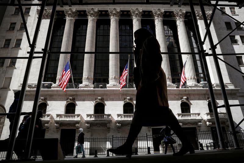 People are seen outside the NYSE in New York