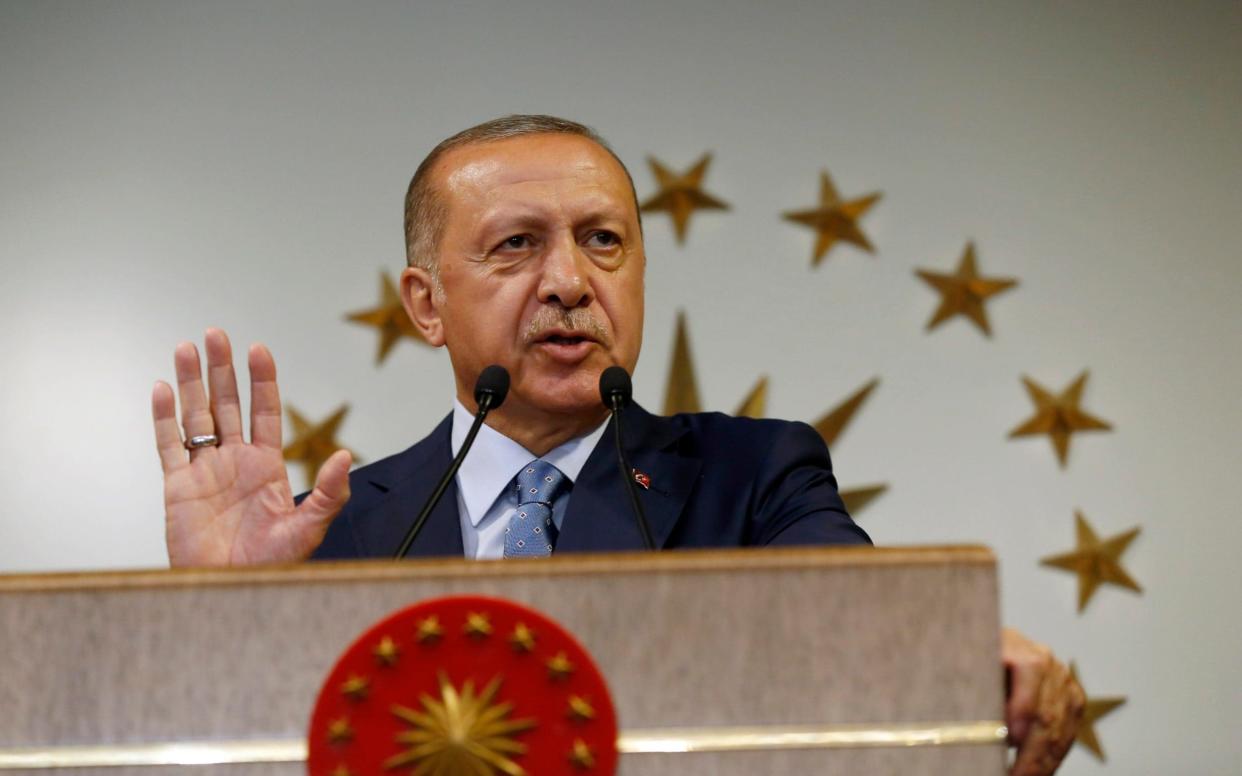 Turkey's President Recep Tayyip Erdogan has been speaking after a rapid devaluation in the country's currency - AP