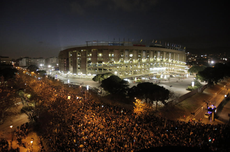 Catalan pro-independence demonstrators gather outside the Camp Nou stadium ahead of a Spanish La Liga soccer match between Barcelona and Real Madrid in Barcelona, Spain, Wednesday, Dec. 18, 2019. Thousands of police and private security personnel were deployed Wednesday in and around Barcelona's Camp Nou stadium to ensure that a protest over Catalonia's separatist movement does not disrupt one of the world's most-watched soccer matches. (AP Photo/Joan Mateu)