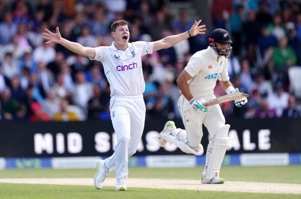 Matthew Potts celebrates the wicket of in-form New Zealand batter Daryl Mitchell (PA)