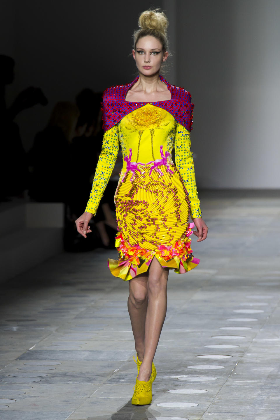 A model displays a creation by designer Mary Katrantzou during a fashion show at London Fashion Week, Tuesday, Feb. 21, 2012. (AP Photo/Jonathan Short)