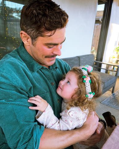 <p>Zac Efron Instagram</p> Zac Efron celebrating his sister Olivia's 3rd birthday in December 2022