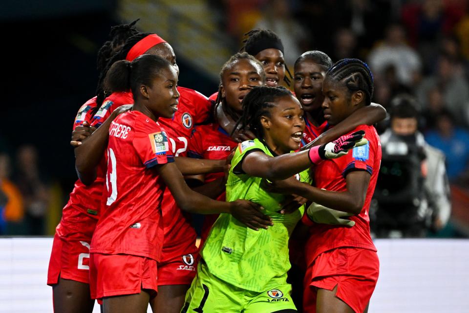 Brisbane, Australia. July 22, 2023. Kerly Theus of Haiti celebrates with her teammates after saving a penalty from England's Georgia Stanway which was later taken back during the 2023 FIFA Women's World Cup soccer match between England and Haiti at Brisbane Stadium in Brisbane, Saturday, July 22, 2023. (AAP Image/Darren England) NO ARCHIVING, EDITORIAL USE ONLY. Source: Australian Associated Press/Alamy Live News