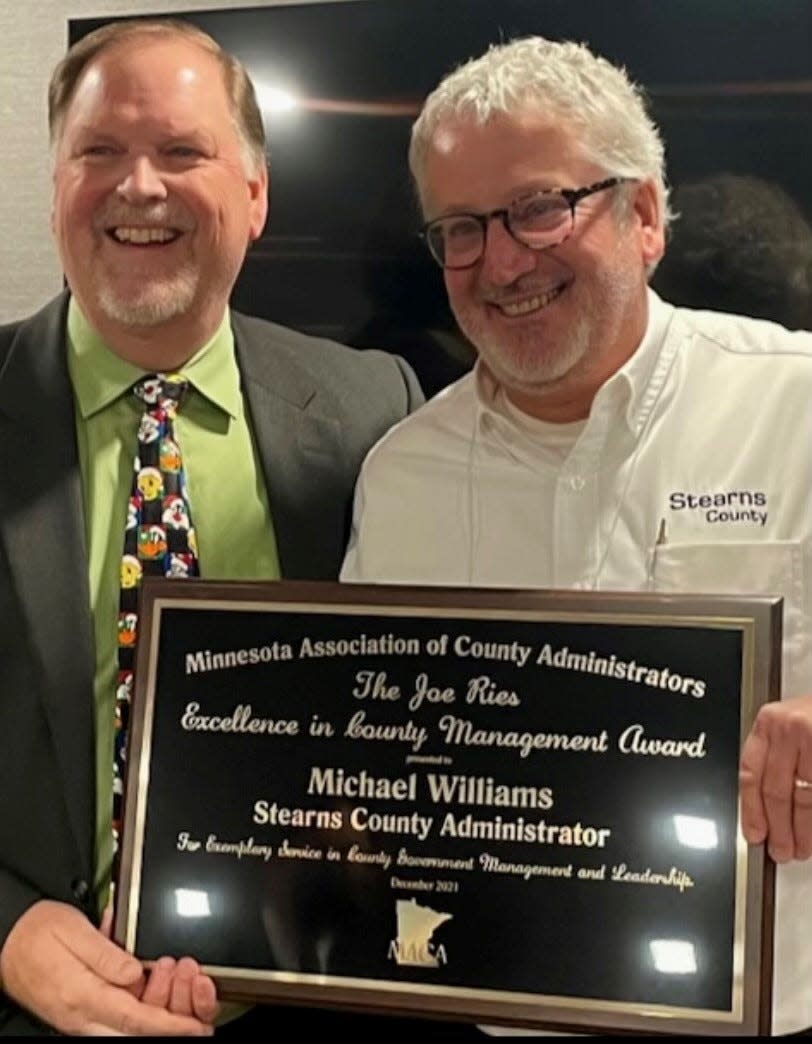 Stearns County Administrator Michael Williams (right) receives the Joe Ries Excellence in County Management Award from the Minnesota Association of County Administrators.