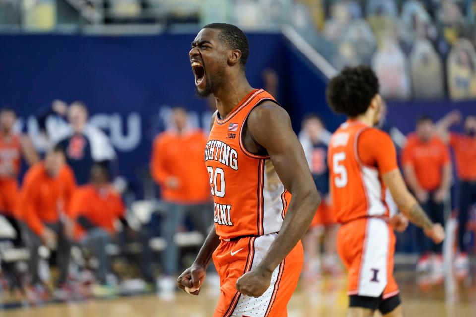 Illinois guard Da'Monte Williams (20) reacts to a play against Michigan in the first half of an NCAA college basketball game in Ann Arbor, Mich., Tuesday, March 2, 2021.