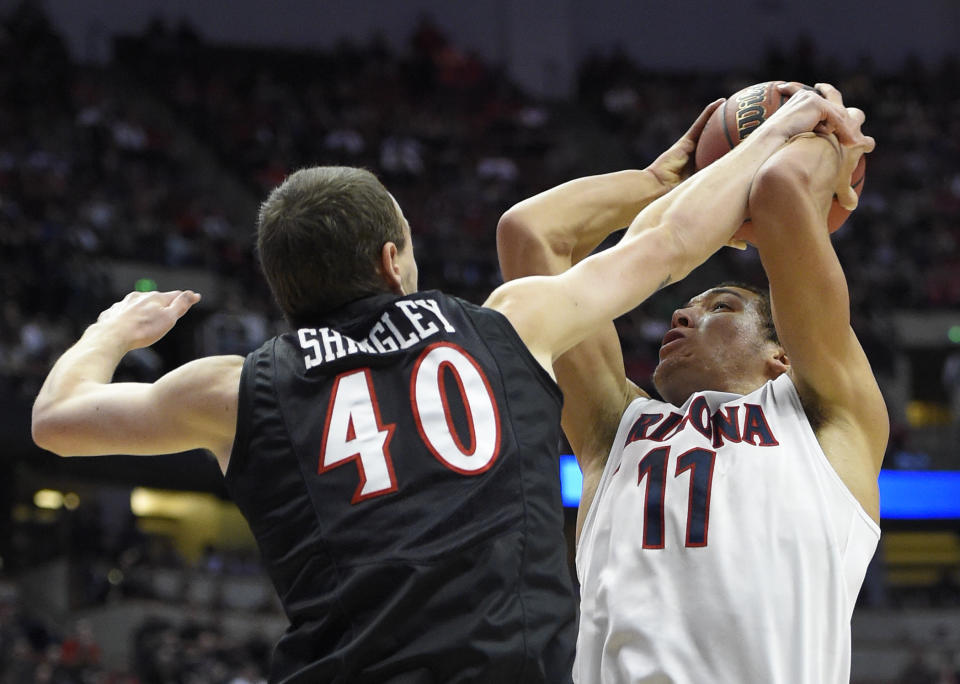 Arizona forward Aaron Gordon (11) is blocked by San Diego State forward Matt Shrigley (40) during the first half a regional semifinal in the NCAA men's college basketball tournament, Thursday, March 27, 2014, in Anaheim, Calif. (AP Photo/Mark J. Terrill)