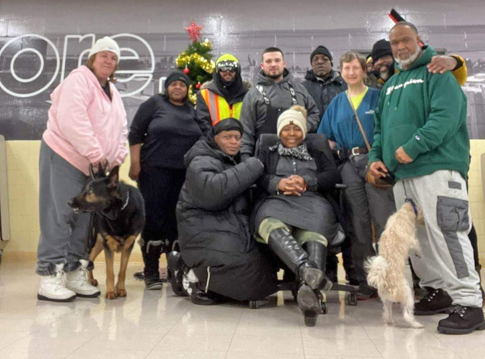 Jay Withey, center, with people he helped find shelter from the storm at Pine Hill School in Cheektowaga, N.Y. (via Cheektowaga Police Dept.)