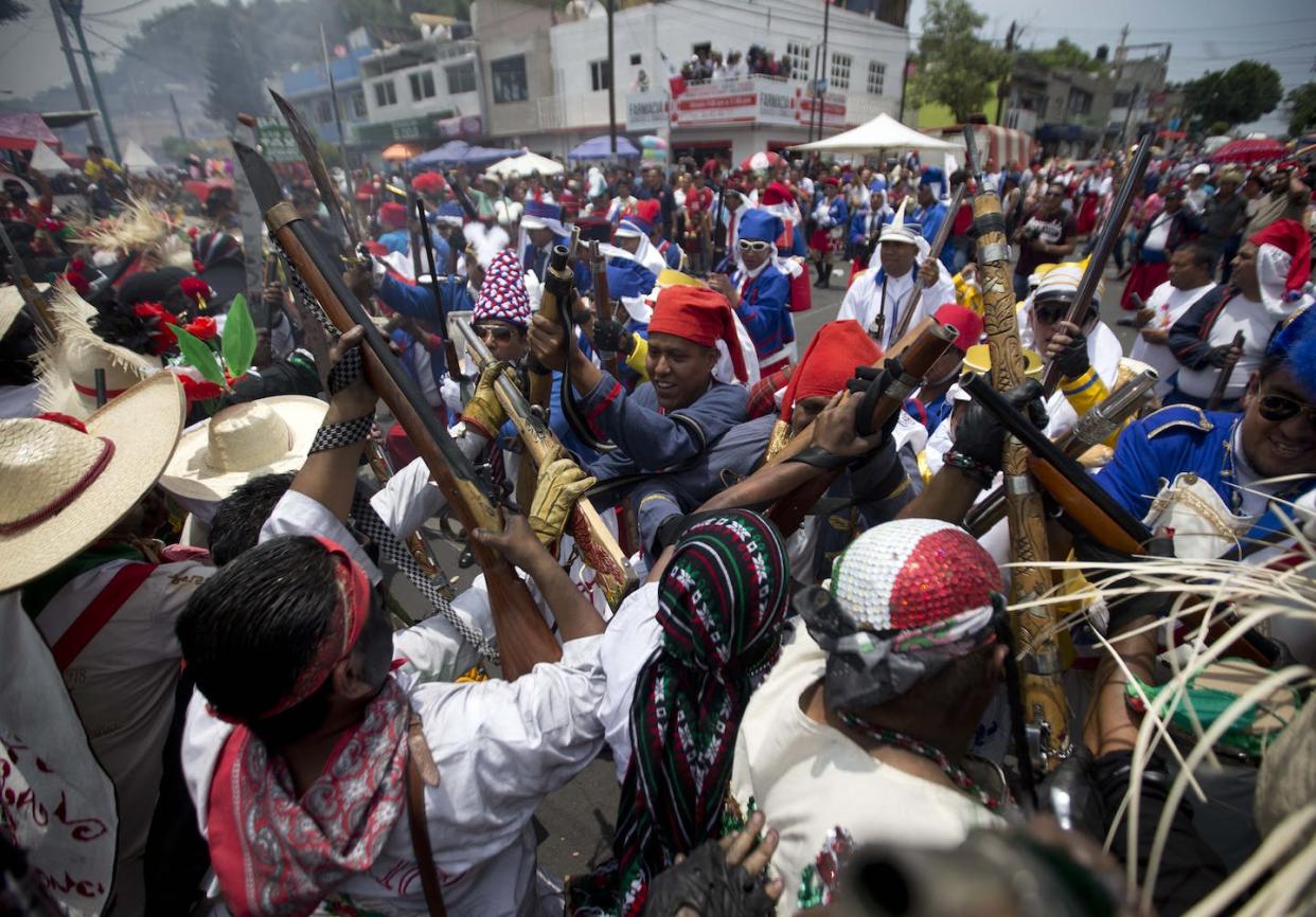 Mexicans representing indigenous soldiers and the French army, re-enact the battle of Puebla during Cinco de Mayo celebrations in Mexico City. <a href="http://www.apimages.com/metadata/Index/Mexico-Cinco-de-Mayo/31c7dc3a568f49ac9991dc64e059ed8b/228/0" rel="nofollow noopener" target="_blank" data-ylk="slk:AP Photo/Eduardo Verdugo;elm:context_link;itc:0;sec:content-canvas" class="link ">AP Photo/Eduardo Verdugo</a>