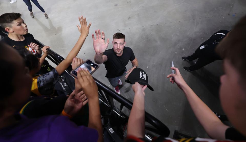 Utah Jazz player Micah Potter high-fives and signs autographs at a draft fan event in Salt Lake City on Thursday, June 22, 2023 during the NBA draft. | Jeffrey D. Allred, Deseret News