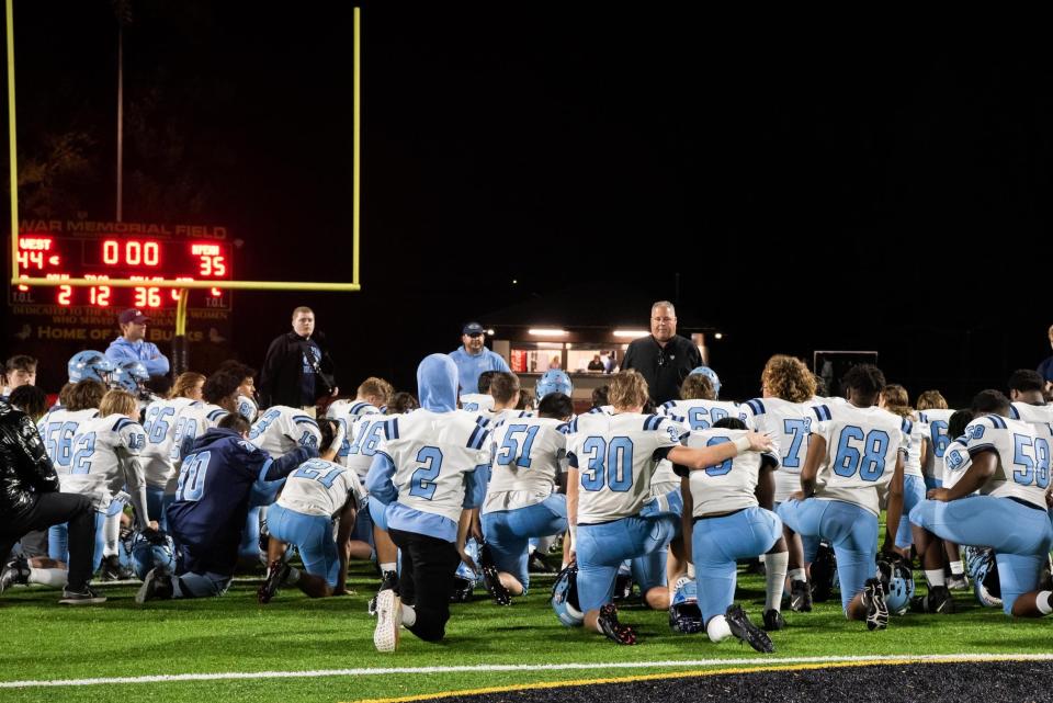 North Penn head coach Dick Beck addresses his team after a loss to Central Bucks West in the 2022 PIAA Class 6A playoffs.