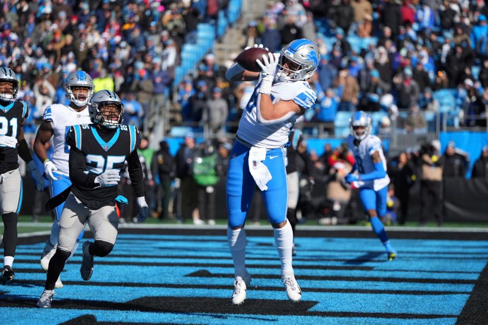 Detroit Lions tight end Shane Zylstra catches a touchdown pass vs. the Carolina Panthers in the first quarter at Bank of America Stadium on Dec. 24, 2022 in Charlotte, North Carolina.