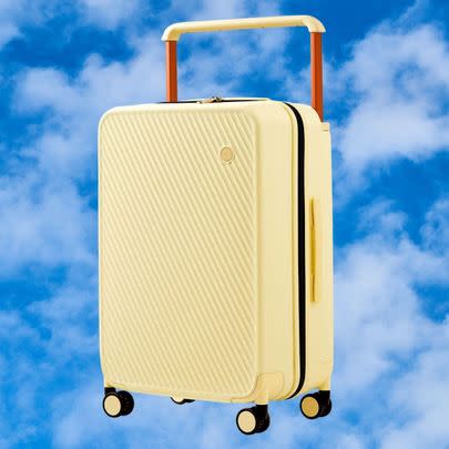 A wide-handled spinner carry-on