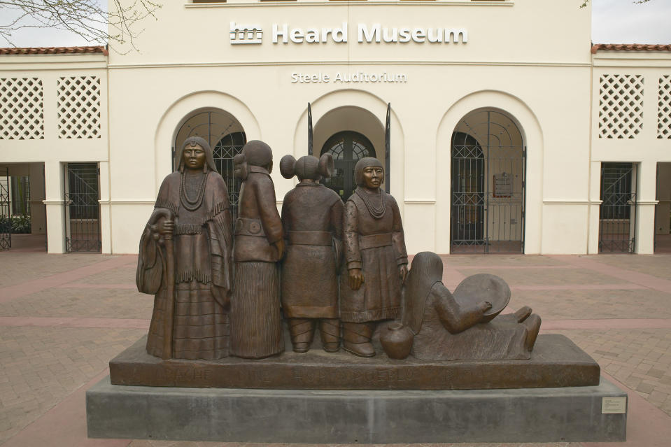The front entrance of the Heard Museum showing a sculpture of Native Americans in Phoenix, Arizona (Joe Sohm / Visions of America / Universal Images Group via Getty Images)