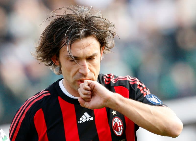 FILE PHOTO: AC Milan's Pirlo celebrates after scoring a penalty against Siena during their Italian Serie A soccer match in Siena