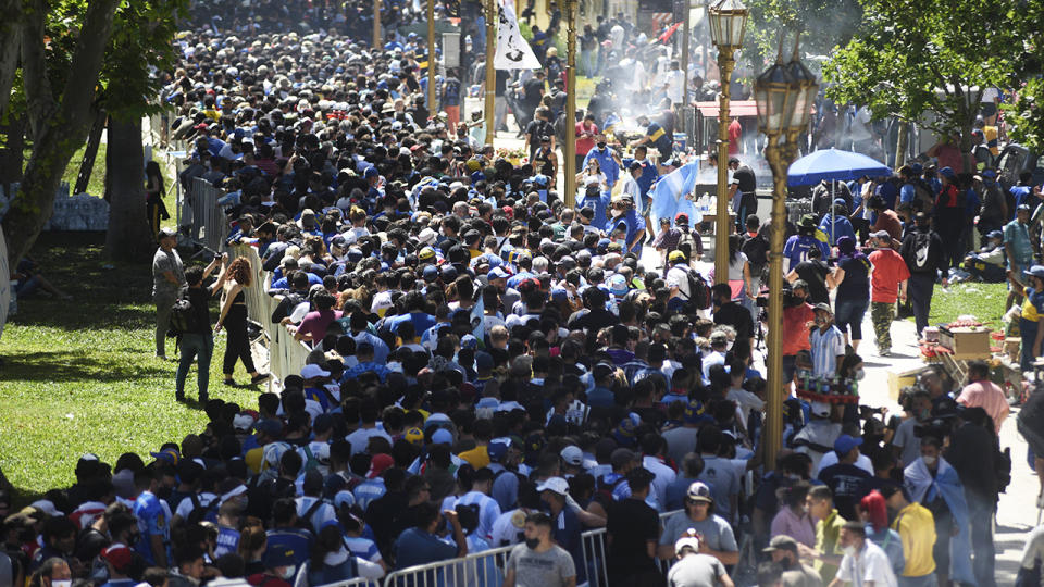 Mouners, pictured here gathering to view Diego Maradona's coffin.