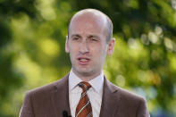 FILE - In this Aug. 20, 2020, file photo President Donald Trump's White House Senior Adviser Stephen Miller speaks during a television interview outside the White House in Washington. One of President Donald Trump's top immigration priorities in a second term would be to use agreements with Central American governments as models to get countries around the world to field asylum claims from people seeking refuge in the United States, Miller said Friday, Oct. 23. (AP Photo/Patrick Semansky, File)