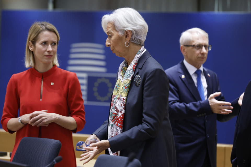 Estonia's Prime Minister Kaja Kallas, left, speaks with European Central Bank President Christine Lagarde during a round table meeting during an EU summit in Brussels, Friday, Oct. 27, 2023. European Union leaders conclude a second day of meetings on Friday in which they will discuss, among other issues, migration. (AP Photo/Omar Havana)