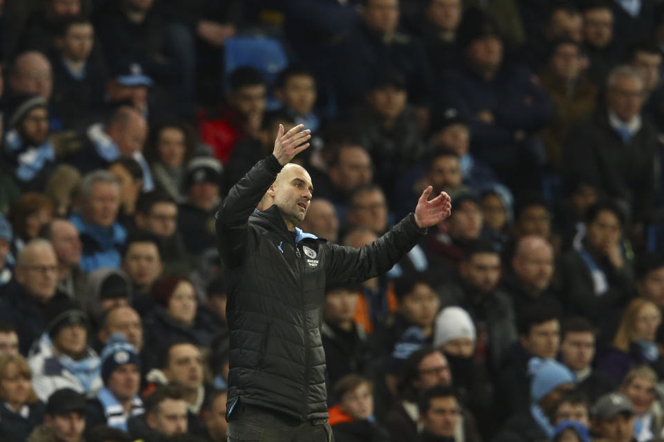 Manchester City's head coach Pep Guardiola gestures during the English League Cup semifinal second leg soccer match between Manchester City and Manchester United at Etihad stadium in Manchester, England, Wednesday, Jan. 29, 2020. (AP Photo/Dave Thompson)