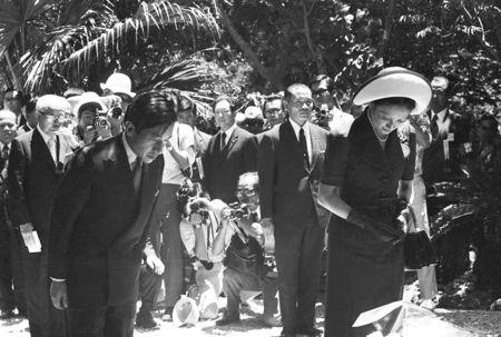 Japan's Crown Prince Akihito and Crown Princess Michiko mourn the victims of the Battle of Okinawa at Himeyuri Peace Memorial monument in Itoman, on the southern Japanese island of Okinawa, Japan July 17, 1975, in this photo released by Kyodo. Mandatory credit Kyodo/via REUTERS
