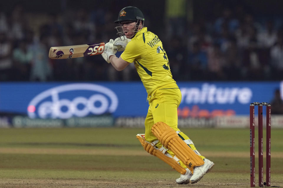 Australia's David Warner plays a shot during the second one day international cricket match between India and Australia in Indore, India, Sunday, Sept. 24, 2023. (AP Photo/Ajit Solanki)