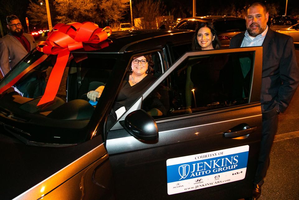 West Port High School teacher Leah Bender, who was named Marion County's 2022 Teacher of the Year, sits behind the wheel of her 2022 Kia Soul provided by the Jenkins Auto Group. The automobile company gave her a three-year lease for winning the award.