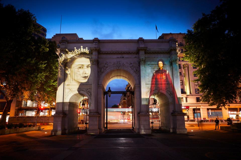 Two portraits of Queen Elizabeth II from the collection of London's National Portrait Gallery are among a reel of six projected on the Marble Arch in Hyde Park to celebrate the Platinum Jubilee.