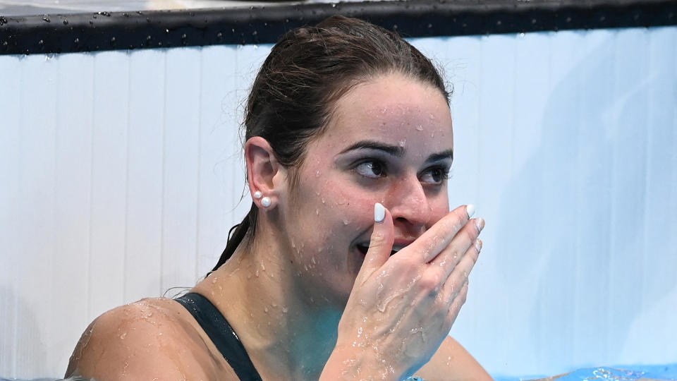 Australia's Kaylee McKeown reacts after winning the final of the women's 100m backstroke. (Photo by Attila KISBENEDEK / AFP)