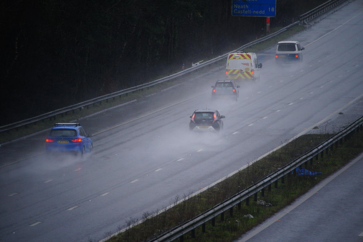 Traffic on the M4 motorway at Bridgend in Wales during wet weather. Picture date: Sunday February 13, 2022.