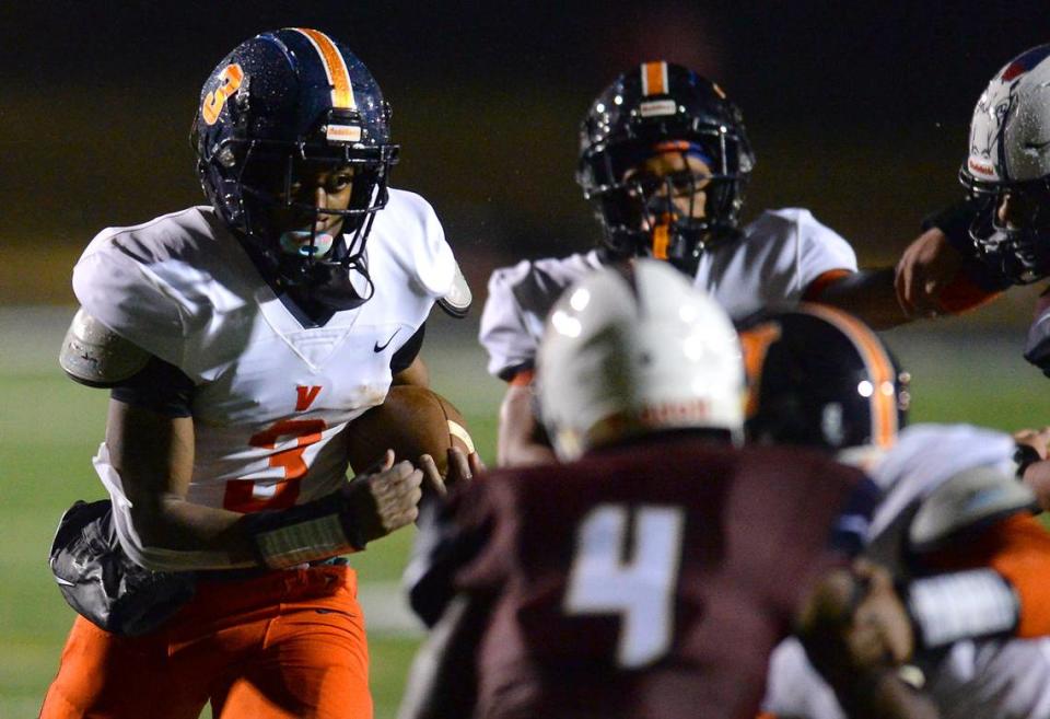 Vance Cougars running back Daylan Smothers, left, rushed for 162 yards and two TDs in Vance’s 27-7 win over Mallard Creek Friday.