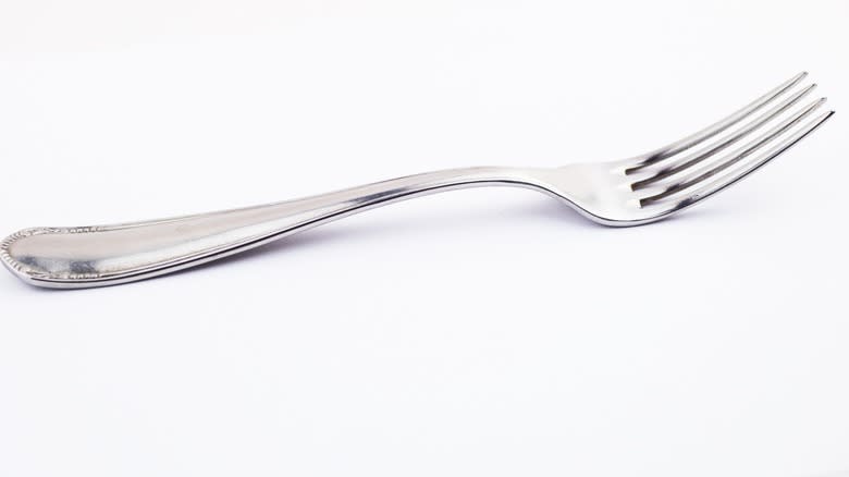 metal fork on a white background