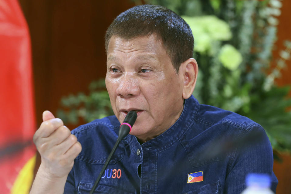 In this photo provided by the Malacanang Presidential Photographers Division, Philippine President Rodrigo Duterte meets members of the Inter-Agency Task Force on the Emerging Infectious Diseases at the Malacanang presidential palace in Manila, Philippines Thursday, July 30, 2020. (Robinson Ninal Jr./Malacanang Presidential Photographers Division via AP)