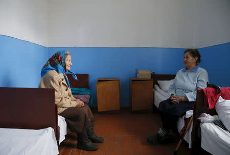 Patients talk as they wait for procedures at a clinic in the village of Staiky, south of Kiev, Ukraine, November 11, 2015. REUTERS/Valentyn Ogirenko