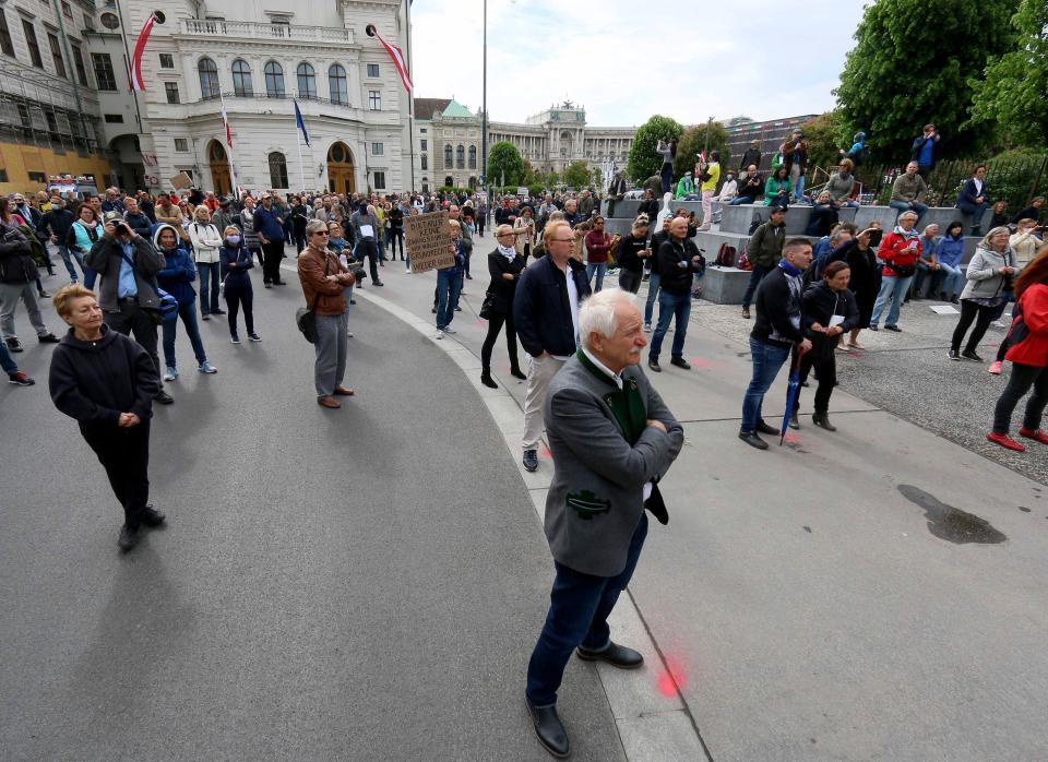 Participants obey social distancing rules during a demonstration against the measures of the Austrian government in Vienna on May 1, 2020. The Austrian government has moved to restrict freedom of movement for people, in an effort to slow the onset of the COVID-19 coronavirus.