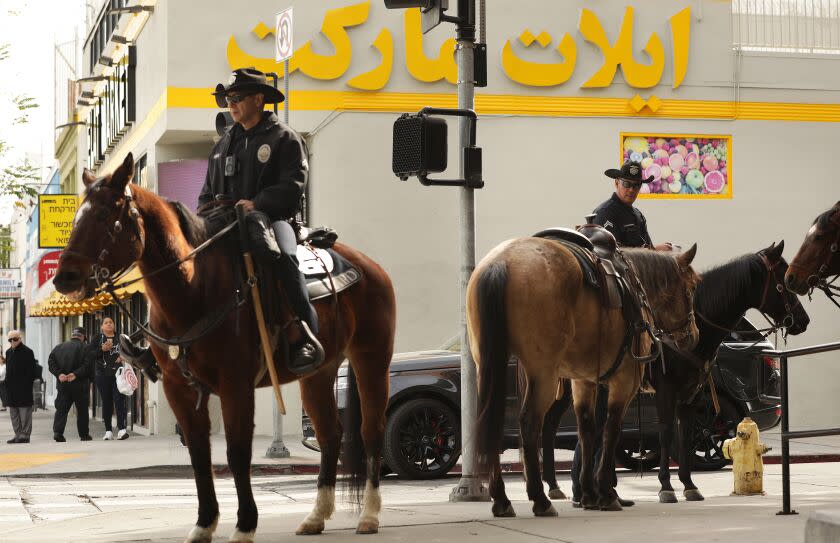 LOS ANGELES-CA-FEBRUARY 17, 2023: LAPD on horseback along Pico Boulevard after the recent shootings of two Jewish men in the Pico-Robertson area of Los Angeles on Thursday, February 17, 2023. (Christina House / Los Angeles Times)