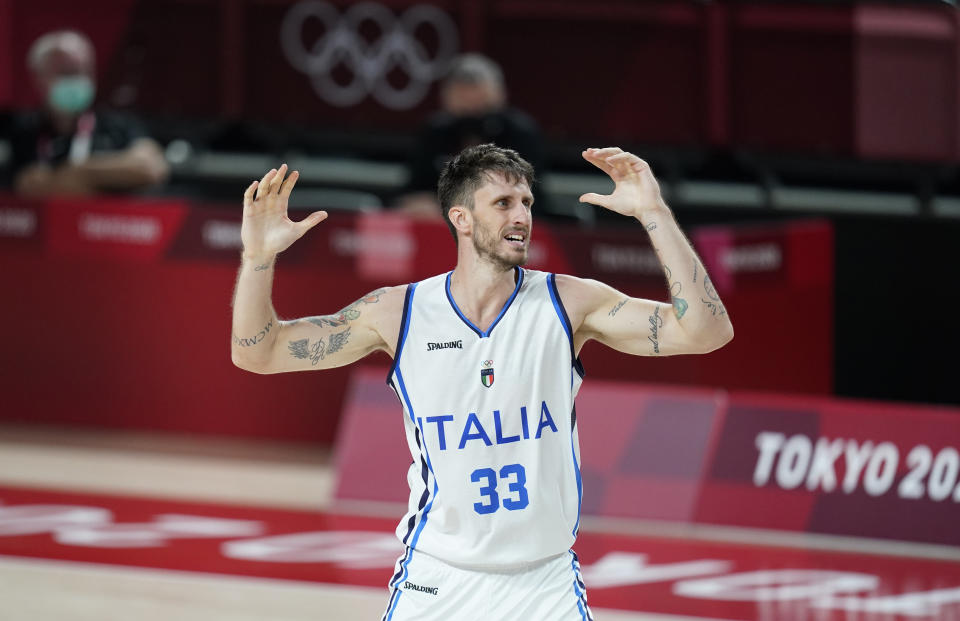 Italy's Achille Polonara (33) reacts after missing a shot during men's basketball preliminary round game against Nigeria at the 2020 Summer Olympics, Saturday, July 31, 2021, in Saitama, Japan. (AP Photo/Charlie Neibergall)