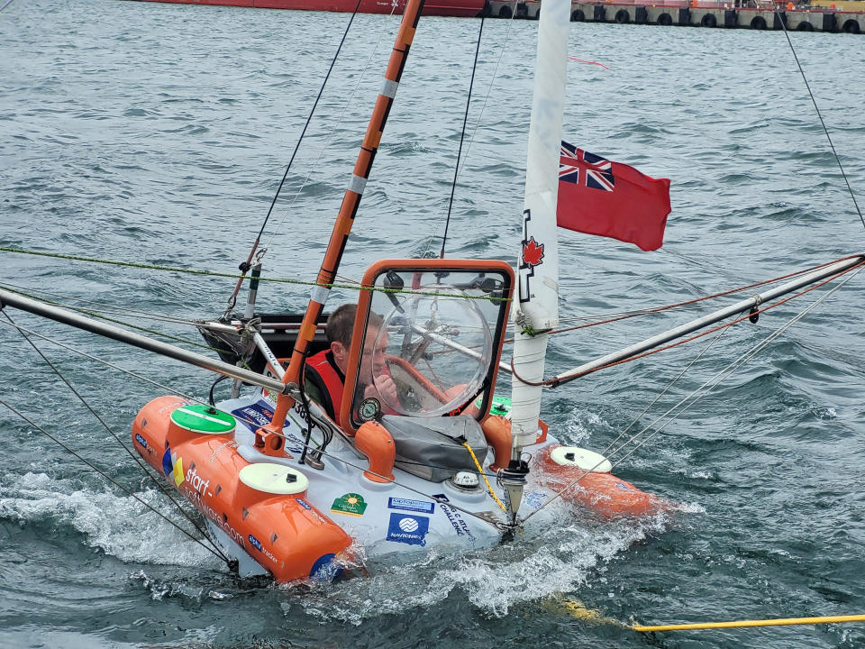 A daredevil dad has set sail in his ONE-METRE long boat from Canada - which he hopes will become the smallest ever vessel to cross the Atlantic Ocean. Andrew Bedwell, 49, said he was “quite chilled” about his 1,900-mile solo trip to the British Isles before he left St John's, Newfoundland, at 1.30pm local time yesterday (Sat). See SWNS story SWNJdepart. The mariner has spent three years hand-building his incredible fibreglass micro-yacht - aptly named Big C - which measures 3.5m tall and has a top speed of 2.5mph.And he’ll survive vitamin-based drinks and food bags made of beef jerky, raisins, and fat during his perilous passage, which have been moulded into the walls of his cabin.
