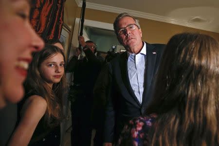 Former Florida Governor Jeb Bush meets guests at a house party during a campaign stop in Dover, New Hampshire March 13, 2015. REUTERS/Shannon Stapleton