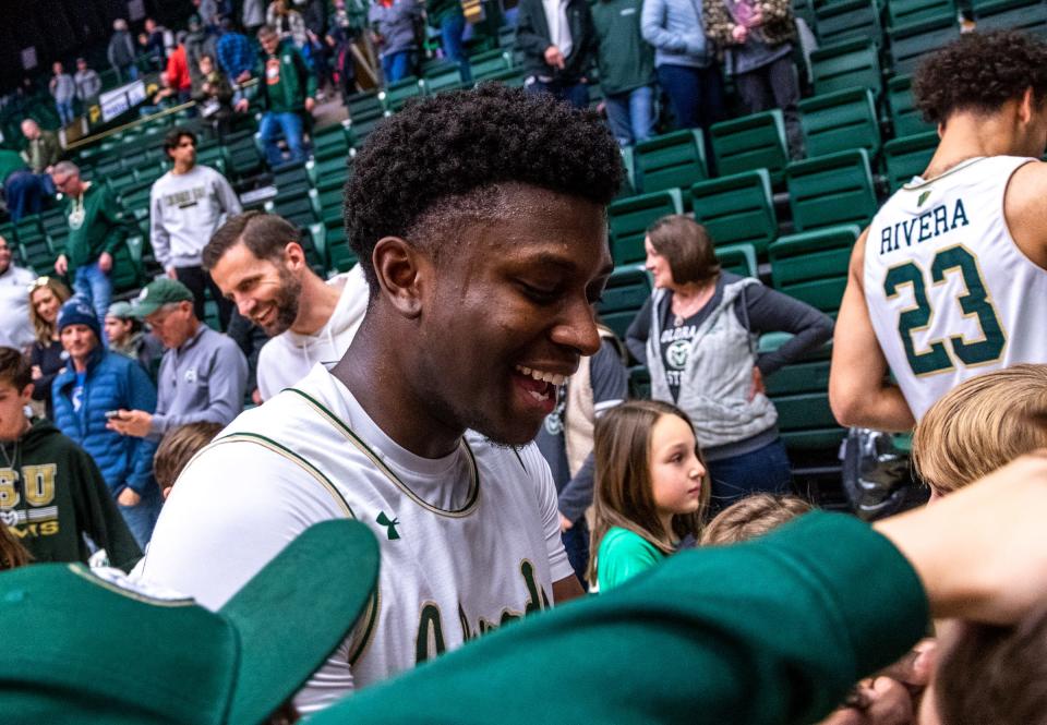 Colorado State senior guard Isaiah Stevens signs autographs for young fans after a win against Fresno State at Moby Arena on Saturday Jan. 7, 2023.