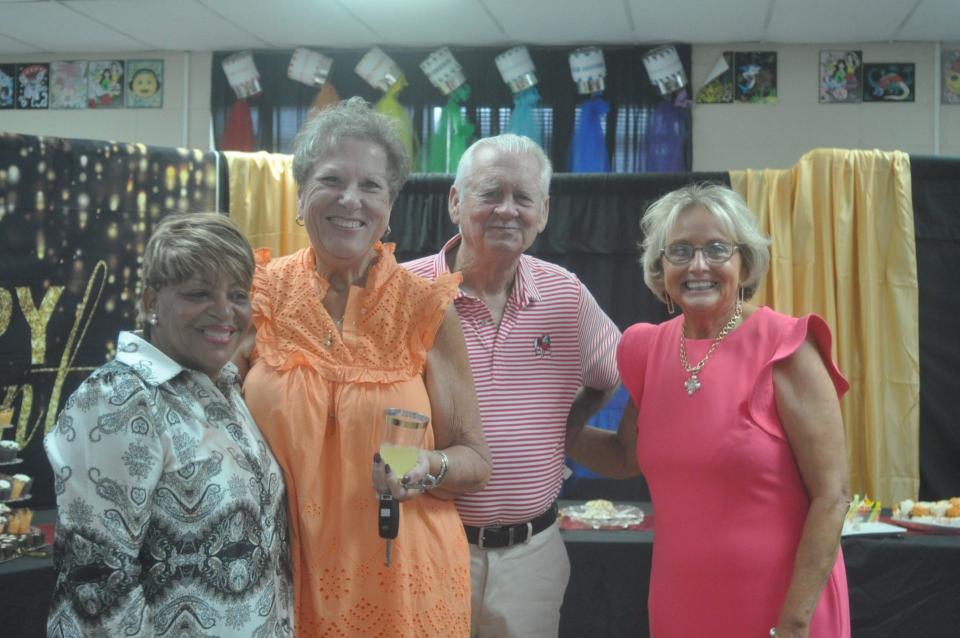 Wanda Davis (at right) poses with supporters at her retirement celebration held Thursday, June 13.