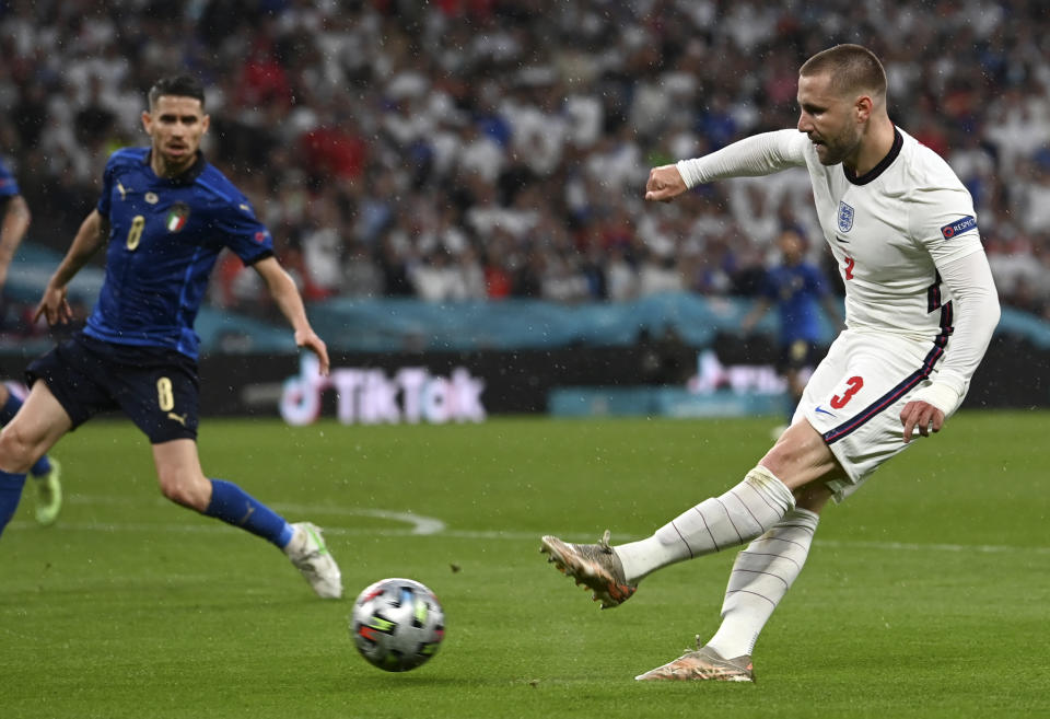England's Luke Shaw takes a shot during the Euro 2020 soccer championship final match between England and Italy at Wembley Stadium in London, Sunday, July 11, 2021. (Paul Ellis/Pool via AP)