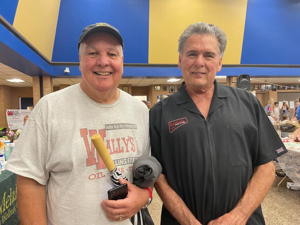 Mark Cawood, the unofficial Mayor of Karns, and Mike Gordon, owner of Gordon’s Drug Store, explore the more than 100 vendors in the common area. Karns Community Fair at Karns High School Saturday, July 16, 2022